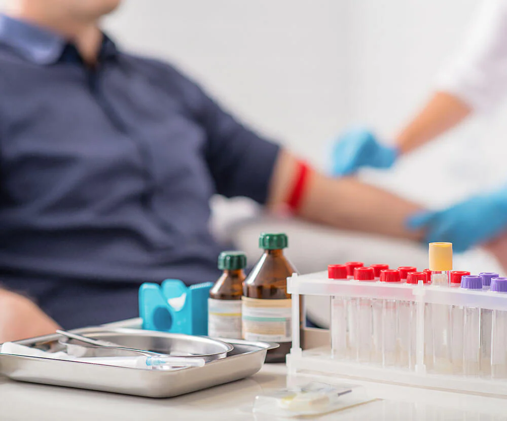 Photo of a man getting his blood drawn to be tested