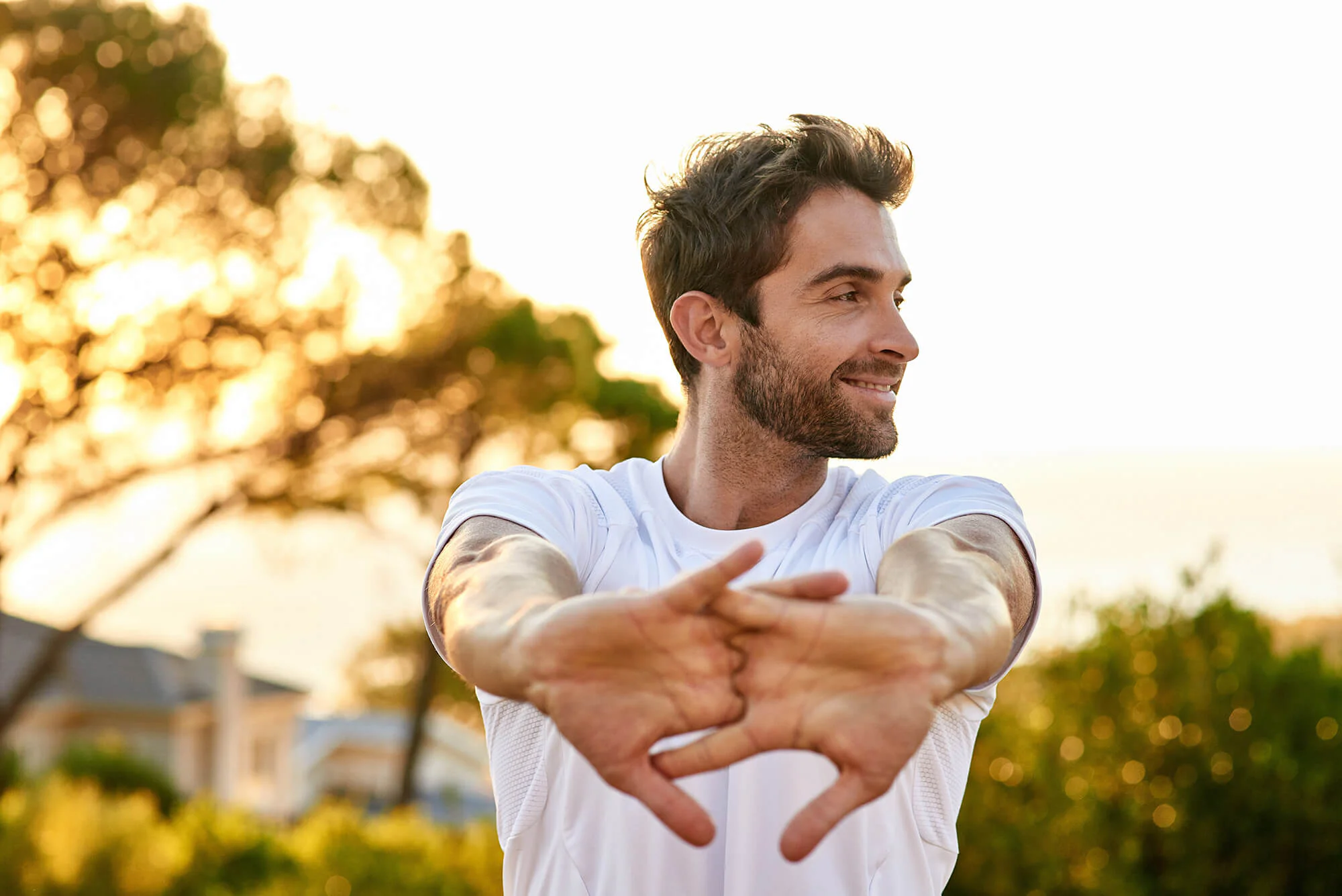Athletic male stretching outside